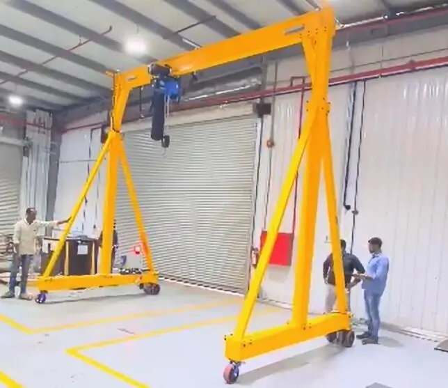 portable gantry crane lifting materials in warehouse